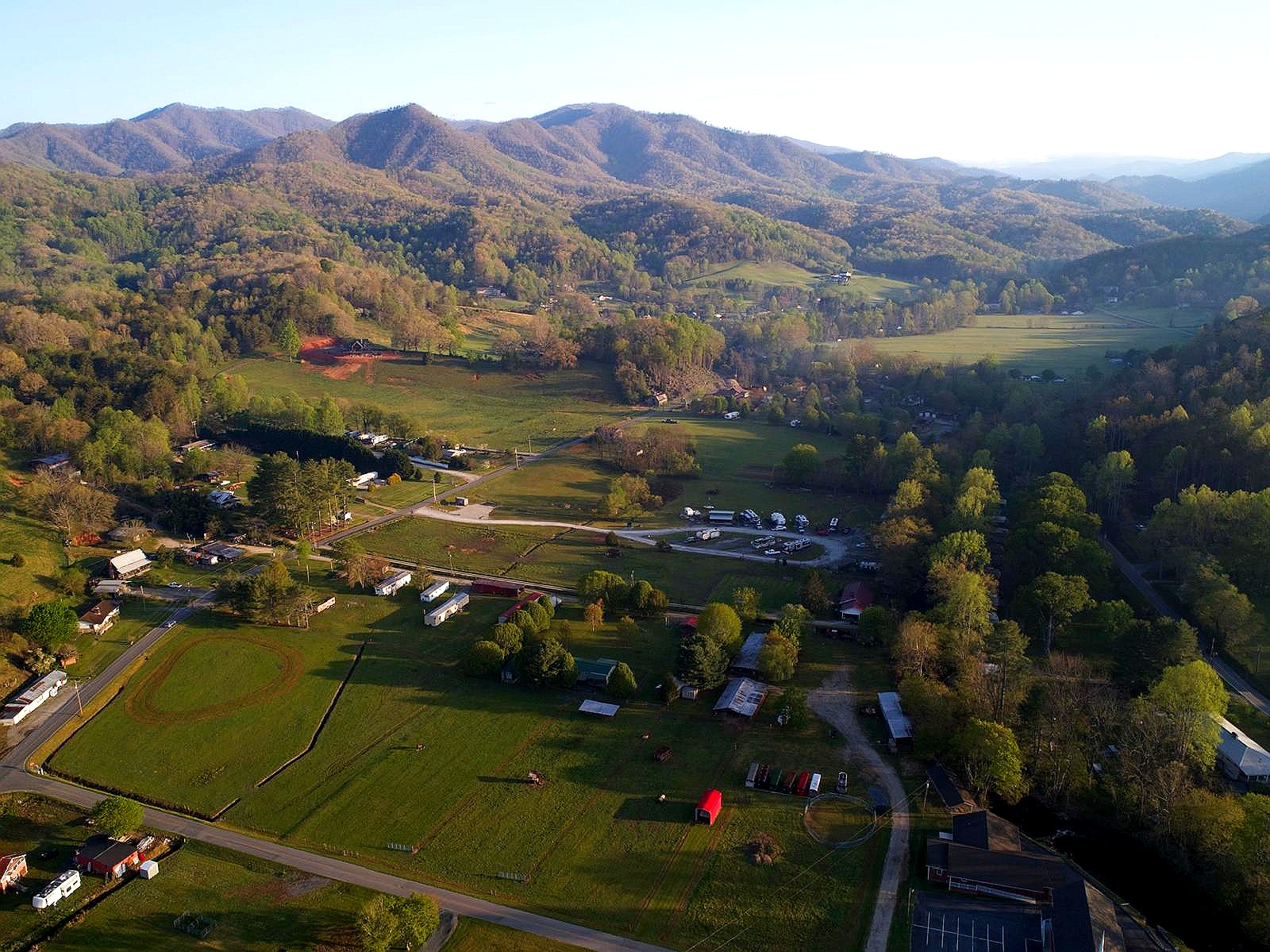 Wide aerial of the valley, pastures and mountains on the approach to the NATIVA property