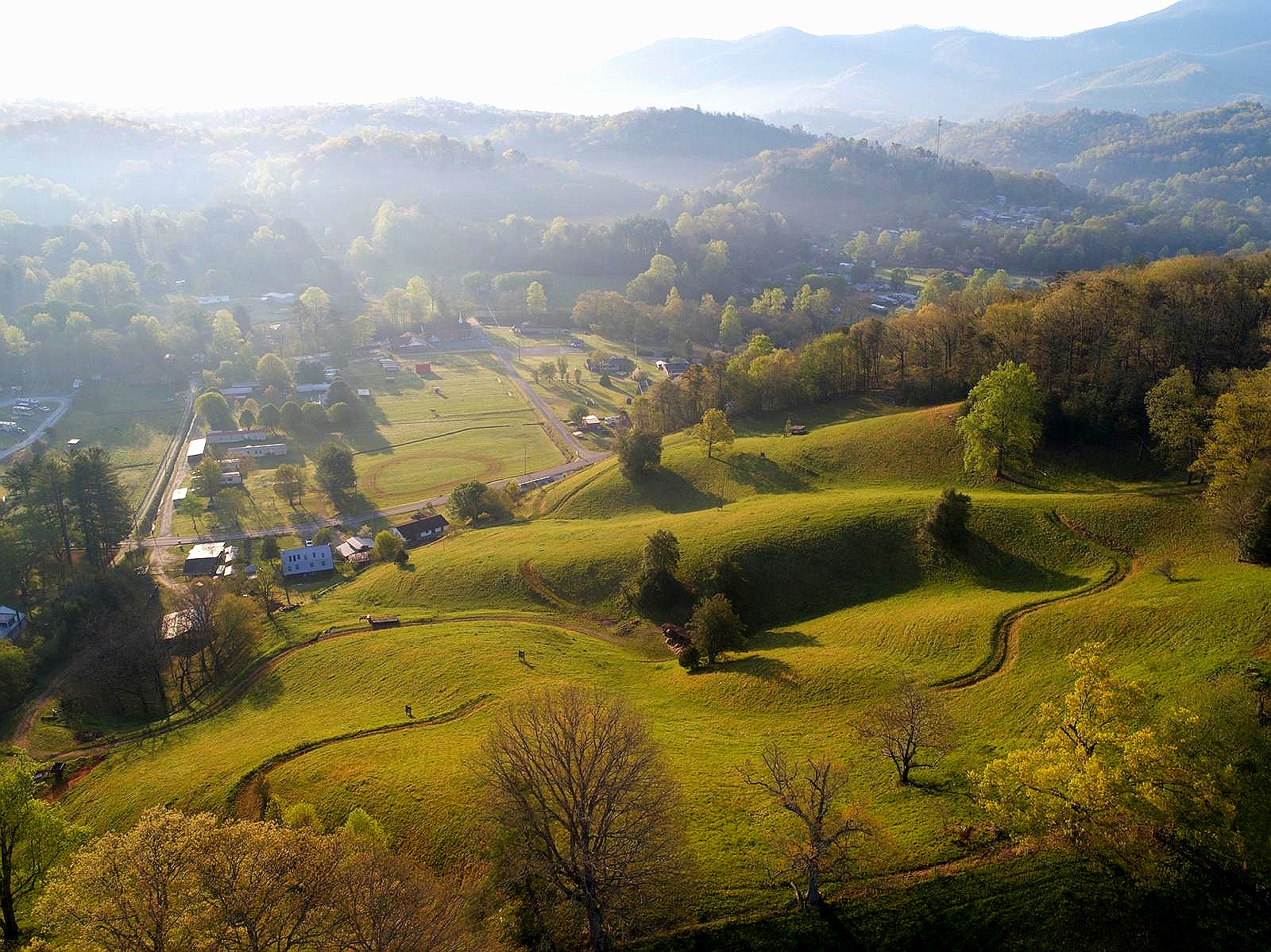 Misty morning aerial of the valley and ridgelines near the NATIVA property